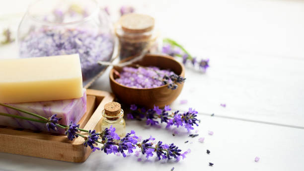 istock Lavender soap and Spa products with lavender flowers on a white table. 1272485692