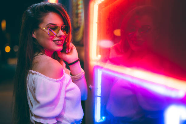 istock Woman and neon light 1272485812