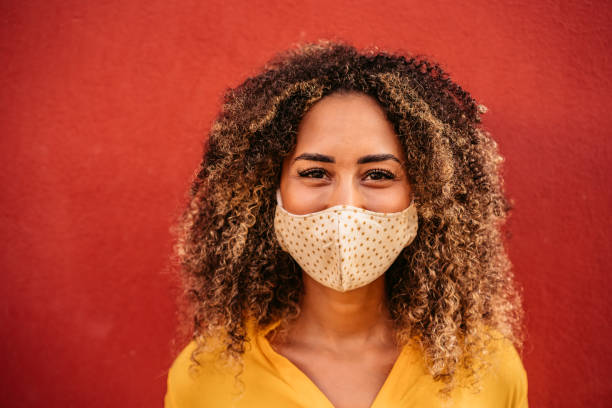 istock Young woman wearing face mask 1272486034