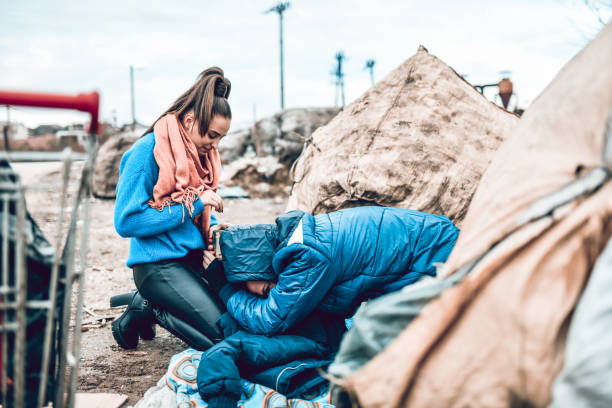 istock Homeless Male Begging Female For Help 1272486442
