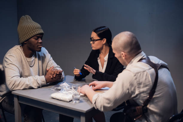 istock A drug dealer detained with a package containing an unknown white substance is interrogated by an experienced investigator in the presence of a lawyer 1272492660