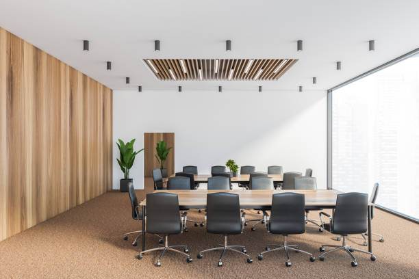 istock White and wooden conference room, side view 1272493684