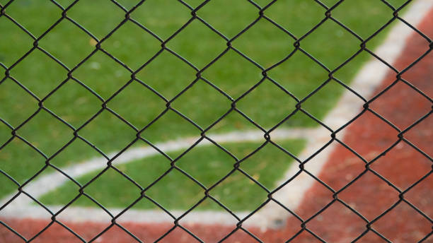 istock Astroturf corner surrounded by iron wires 1272495636