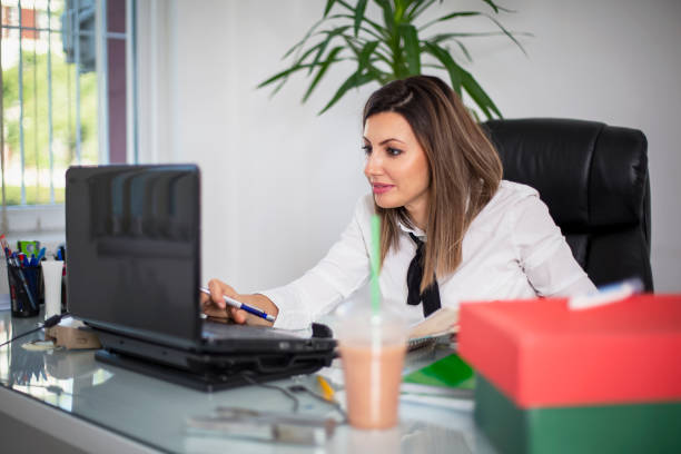 istock Businesswoman working at her desk 1272496655