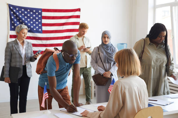 istock People Registering at Voting Station 1272497351