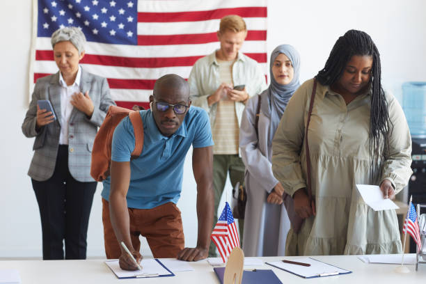 istock People at Voting Station 1272497360