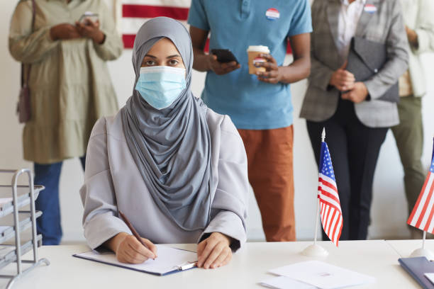 istock Modern Arab Woman Voting at polling Station 1272497382