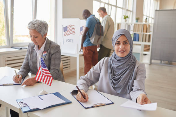 istock Young Arab Woman Working at Voting Station 1272497400
