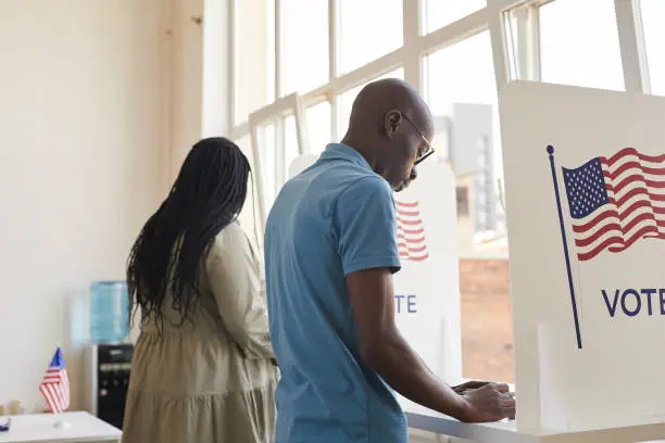 Photo of African-American People in Voting Booth
