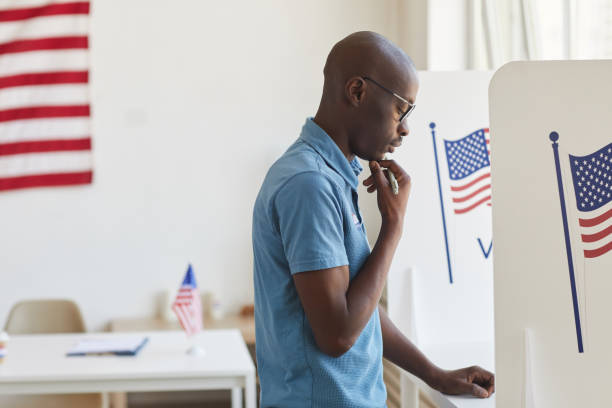 African-American Man in Voting Booth