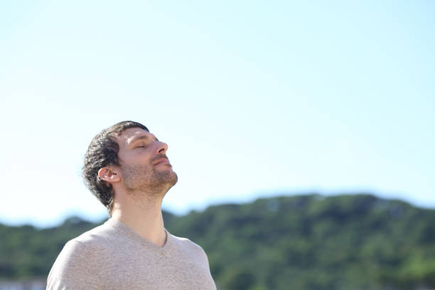 istock Man breathing outdoors fresh air in the mountains 1272497606