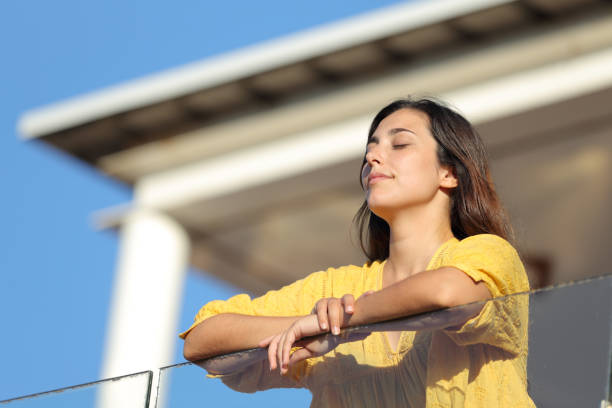 istock Apartment renter relaxing in a balcony a sunny day 1272498330