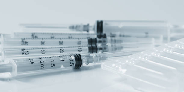 istock there are plastic syringes and capsules with medicine on the table 1272498497