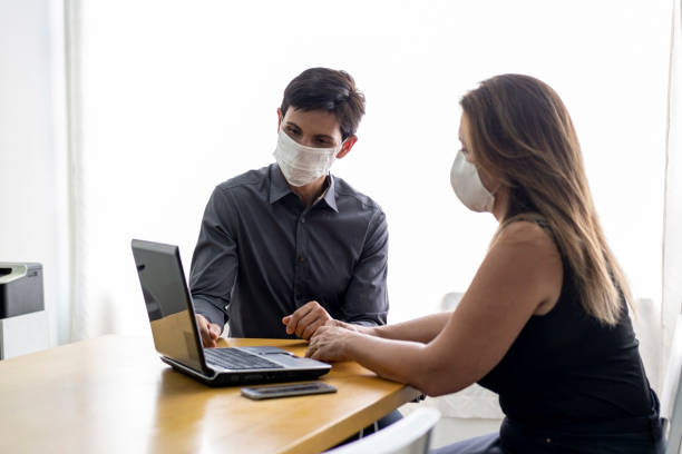 istock Man and woman in a office. 1272504802