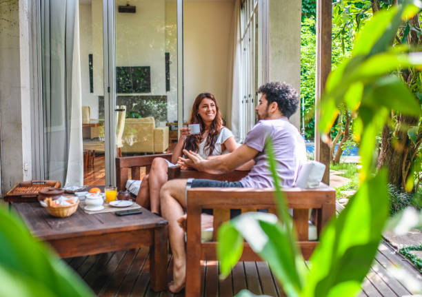 istock Relaxed Morning on Home Deck with Coffee and Conversation 1272505976