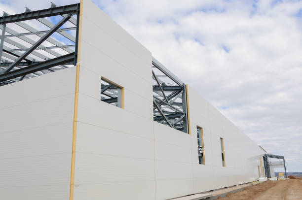 Construction of buildings made of steel structure and sandwich panels. The use of modern building materials Metal frame of the building with a sandwich panel of insulation on the wall. The use of modern building materials sandwich panel photos stock pictures, royalty-free photos & images