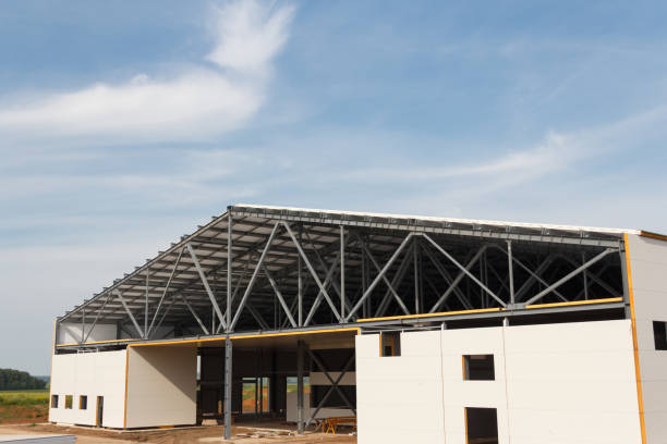 Construction of buildings made of steel structure and sandwich panels. The use of modern building materials Metal frame of the building with a sandwich panel of insulation on the wall. The use of modern building materials sandwich panel photos stock pictures, royalty-free photos & images