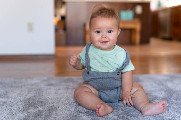 istock Happy baby has mastered sitting! 1272506180