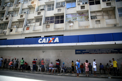 salvador, bahia / brazil - september 8, 2020: people face queues for assistance at Caixa Economica Federal in the neighborhood of Comercio, in the city of Salvador.\