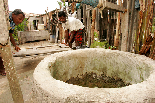 itabela, bahia / brazil - september 9, 2010: people are seen beside a well in a residence in the city of Itabela, in southern Bahia.