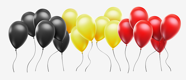 Balloons with belgian flag colors on white background