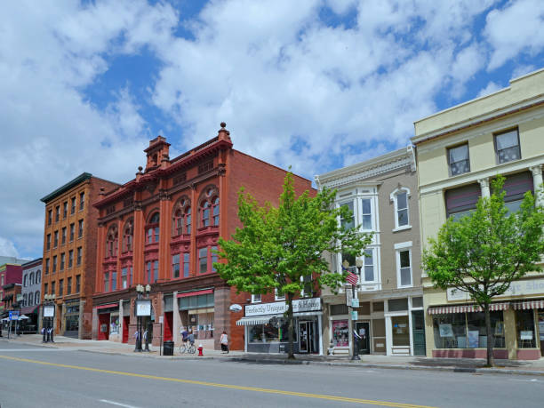 Well preserved 19th century buildings on a main street Geneva, NY, USA - May 25, 2019: Well preserved 19th century buildings on a main street of this small city near the Finger Lakes. finger lakes stock pictures, royalty-free photos & images