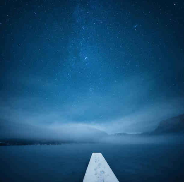 Night At The Frozen Lake Peaceful winter night by the frozen lake. gorenjska stock pictures, royalty-free photos & images