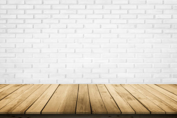 istock Empty wooden table top on white brick wall background, Design wood terrace white. Perspective for show space for your copy and branding. Can be used as product display montage. Vintage style concept. 1272516618