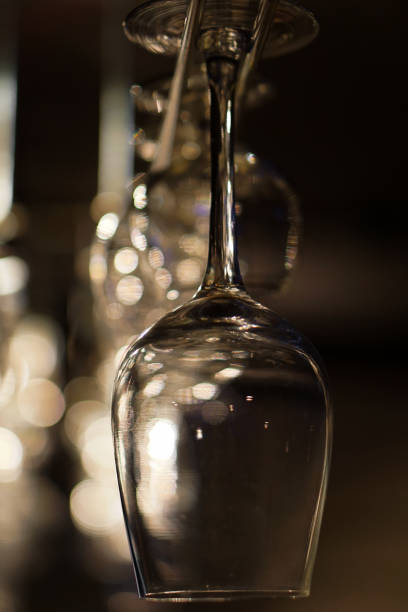 istock wine glass hanging on the bar 1272517348