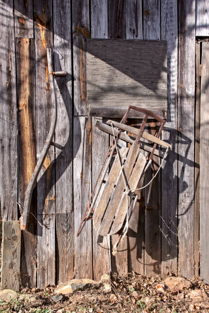 istock Antique Snow Sled on Old Wooden Barn 1272521672