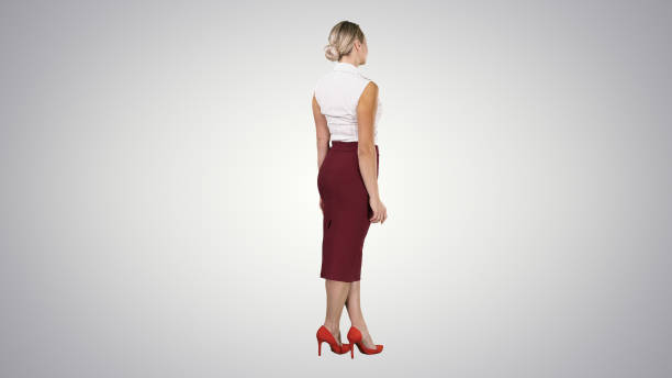 istock Woman putting her hands on her hips on gradient background 1272525609