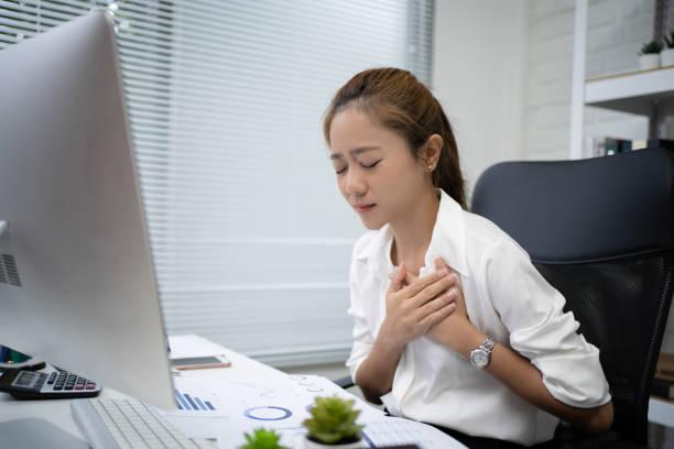 istock Young business women cannot work. She was sick and had a heart attack on the desk. 1272529194