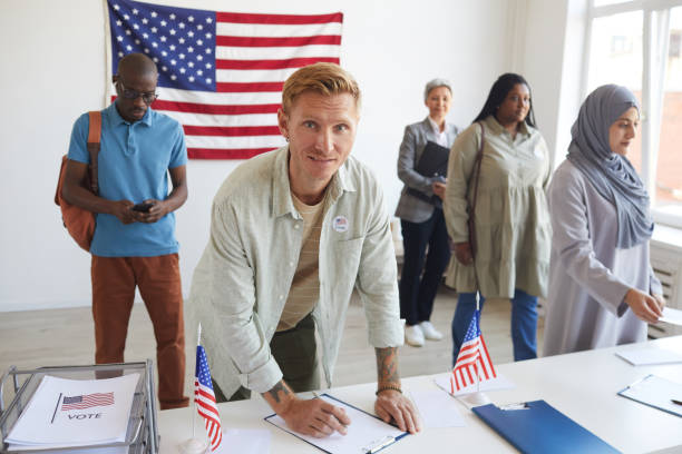 istock People Signing at Voting Station 1272529447