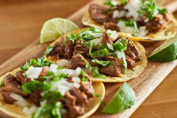 istock three carne asada mexican street tacos in corn tortilla with lime 1272532786