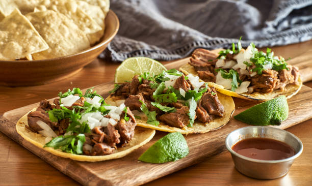 Three Carne Asada Mexican Street Tacos In Corn Tortilla With Lime Stock  Photo - Download Image Now - iStock