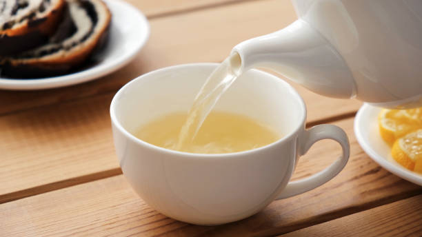 istock Pouring green tea in cup 1272536133