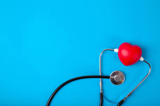 Top view world heart day stethoscope with 29 september text on blue paper background.Free copy space Top view world heart day stethoscope with 29 september text on blue paper background.Free copy space earth first aid stock pictures, royalty-free photos & images