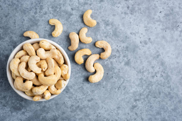 istock Cashews in bowl on concrete background 1272536235