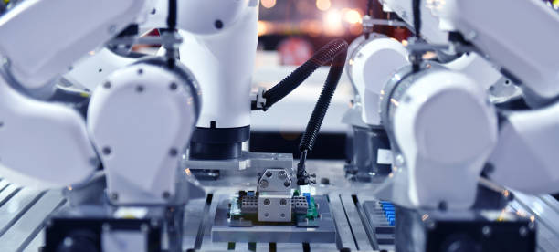 промышленная роботизированная рука для проведения производства электронных печатных плат в машиностроении и технологии - hard drive symbol ideas concepts стоковые фото и изображения
