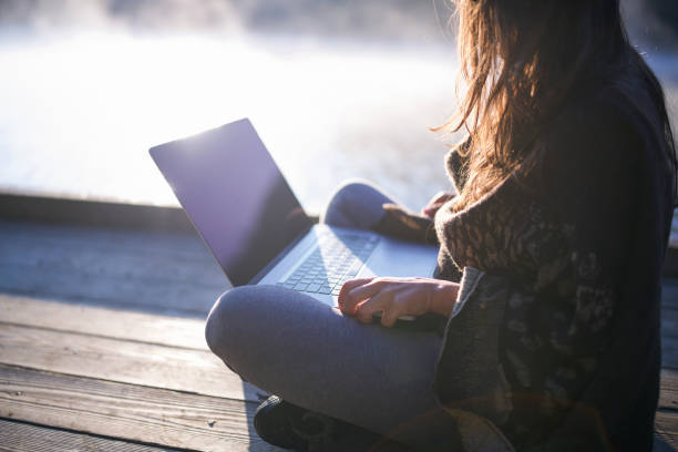 istock Woman Using Laptop In Nature. 1272538754