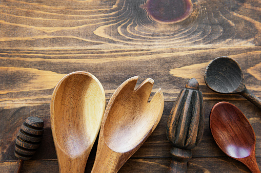 Top view on a wooden cutlery kitchen  ware on a  wooden background, flat lay