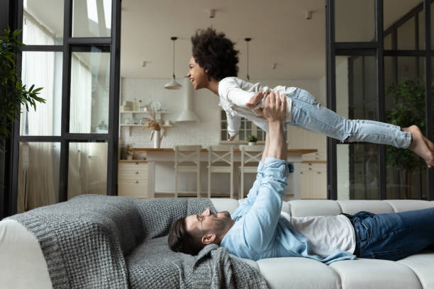 istock Happy european man having fun with mixed race daughter. 1272542124