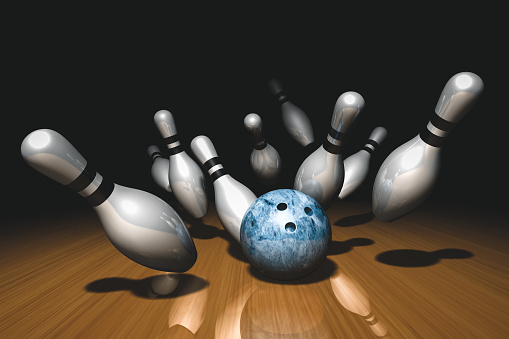 Bowling ball crashing into the pins. 3d rendered.