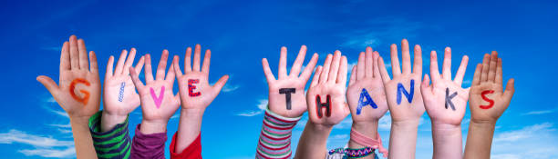 istock Children Hands Building Word Give Thanks, Blue Sky 1272543029