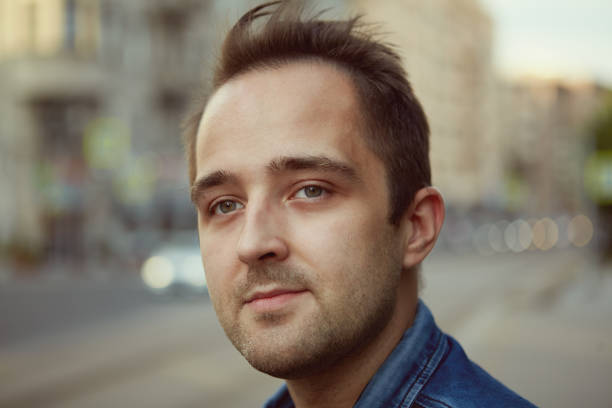 istock Young pensive white man on street. 1272544221
