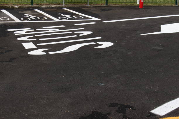 istock Road signs stop and arrow with motorcycle parking 1272545553