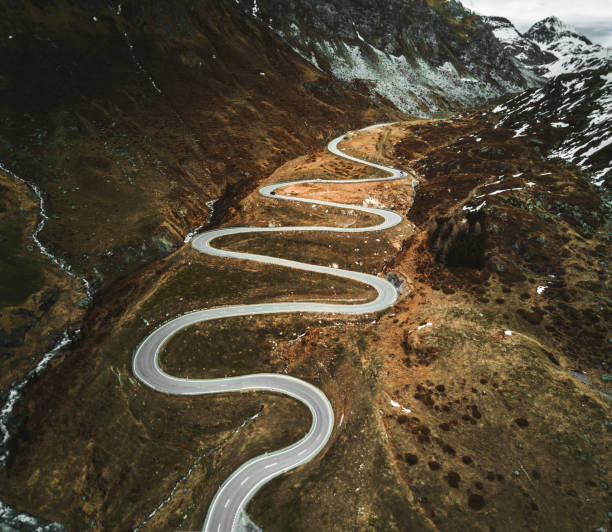 istock winding road in switzerland 1272546181