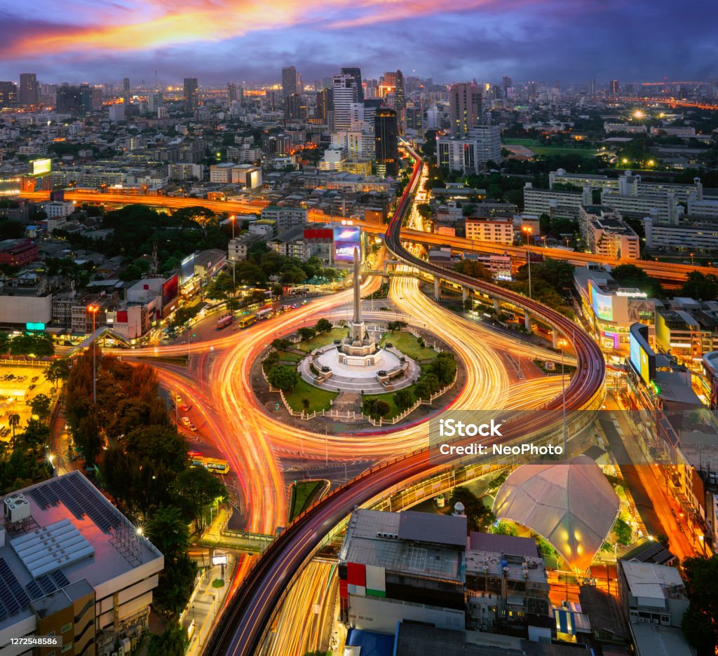 Victory monument Thailand in Bangkok city with sunset and building background Victory monument Thailand in Bangkok city with sunset and building background, view point from rooftop of hotel in Bangkok. Victory Monument - Bangkok Stock Photo