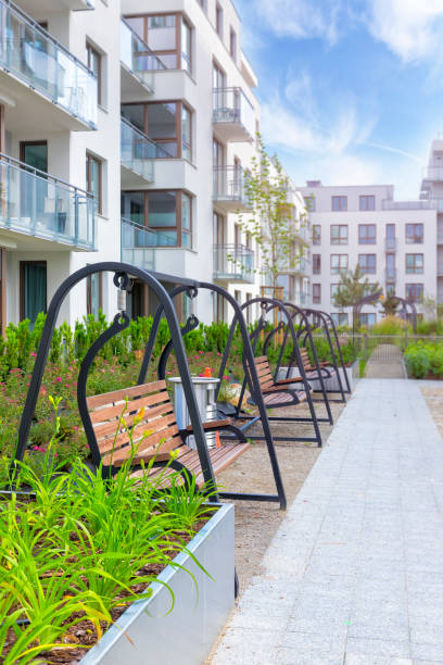 istock Modern benches on a square next to a housing estate 1272551281