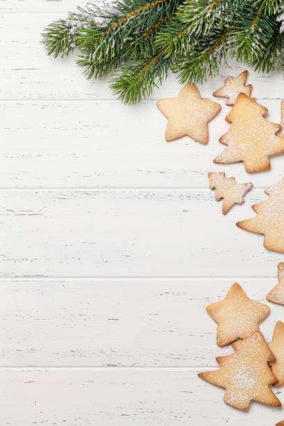istock Christmas gingerbread cookies and xmas fir tree 1272551406